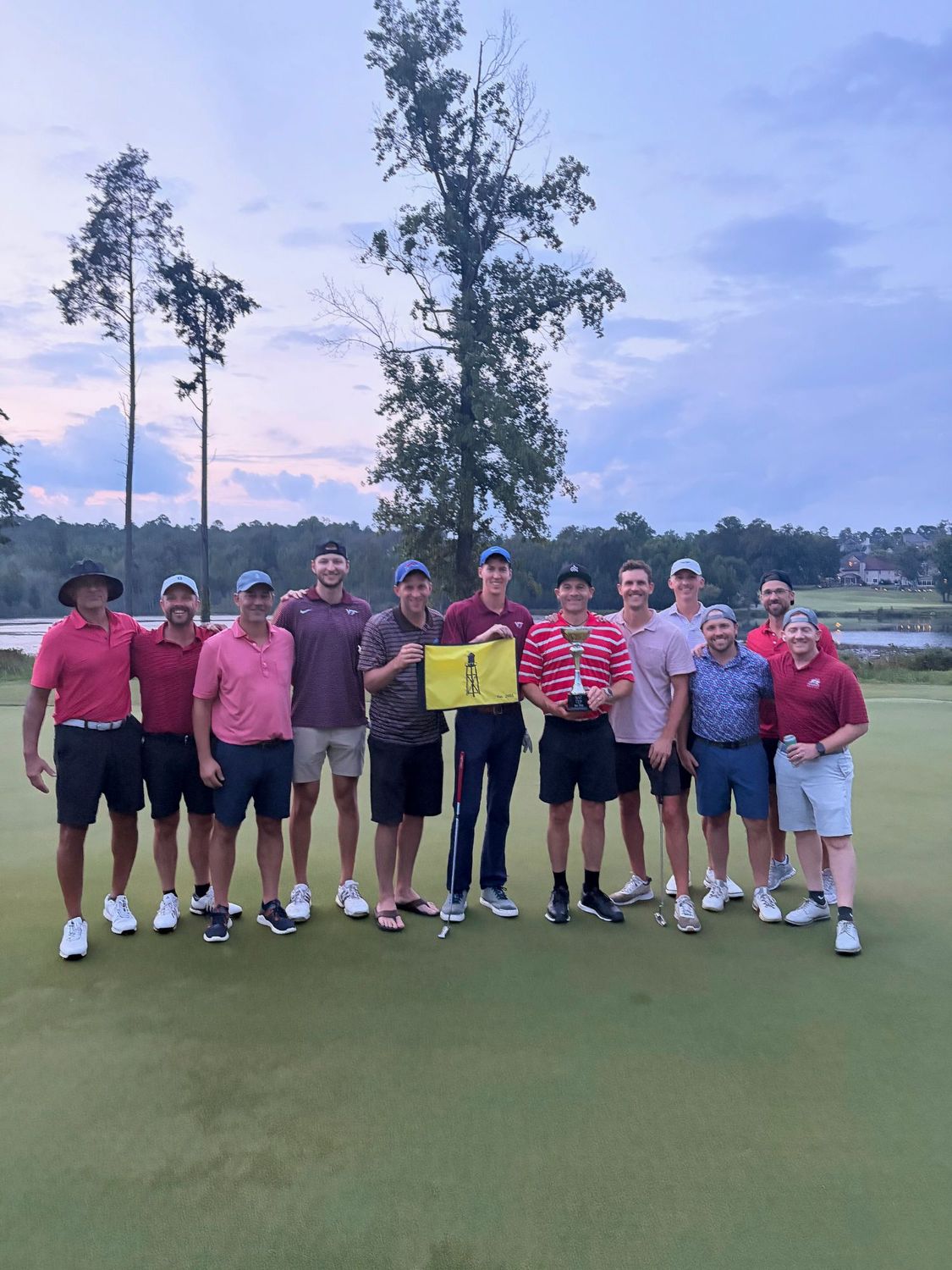 The Chip-Endels with the SAC Cup trophy and the water tower pin flag on the 18th green